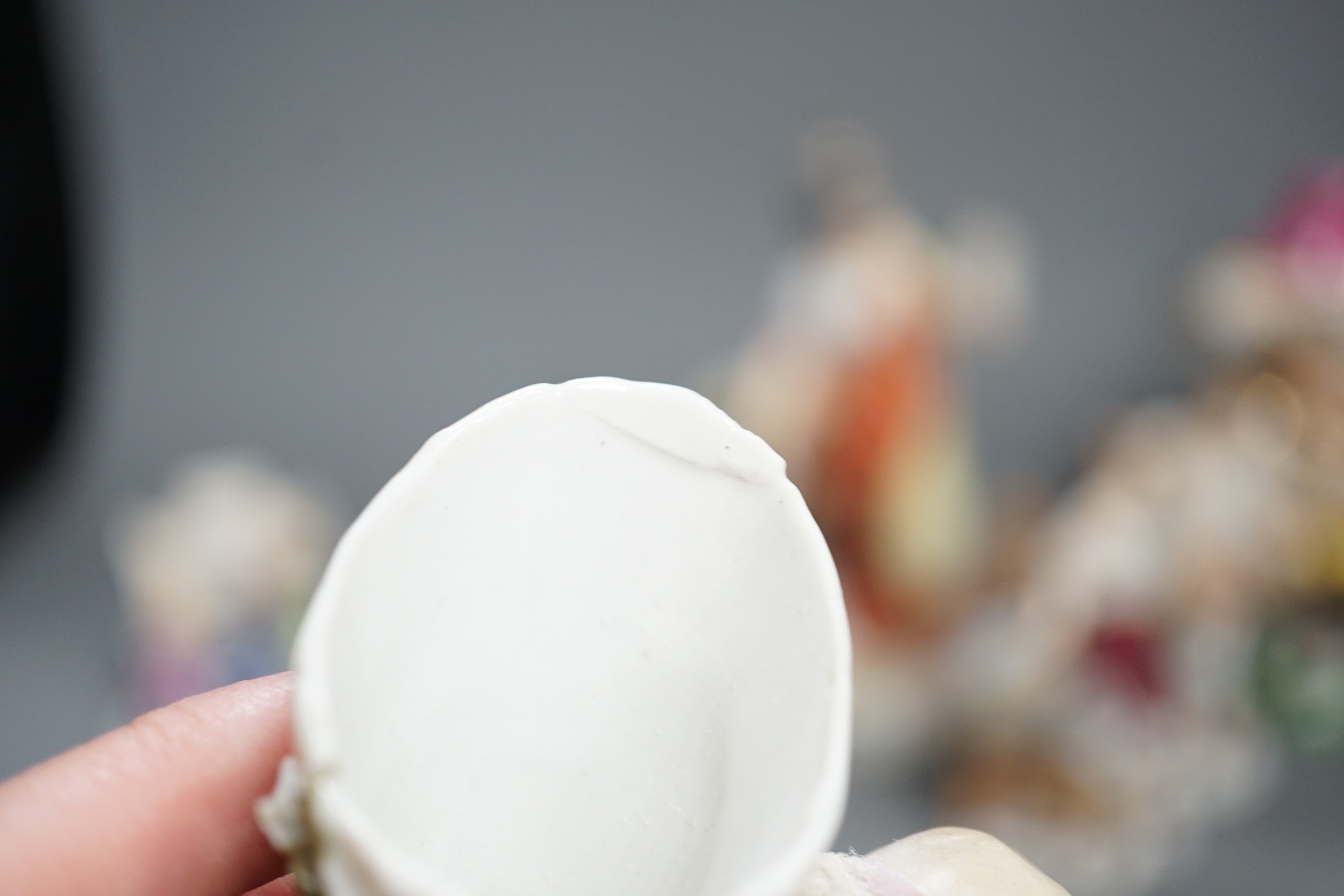 A selection of mainly Continental porcelain figures including Royal Crown Derby style mansion house dwarf